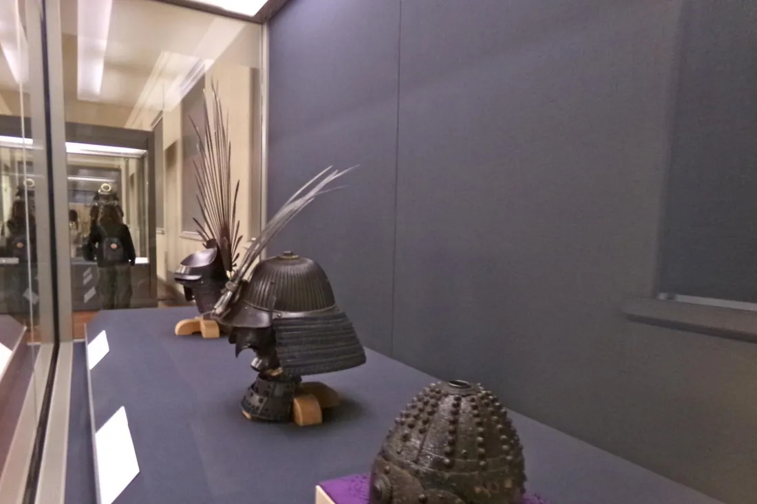 Samurai armor and helmets in glass display cases at the National Museum of Japanese History in Sakura